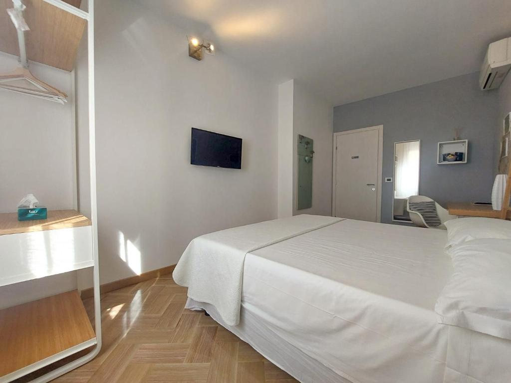 Letto o letti in una camera di MyWay Trieste Rooms