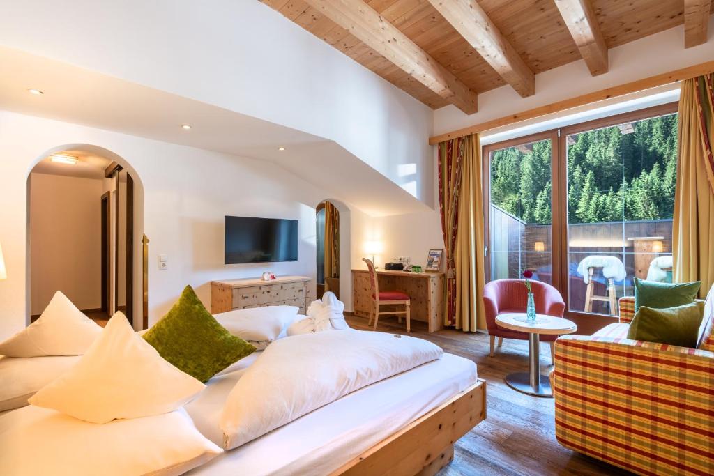 Postel nebo postele na pokoji v ubytování Hotel Platzer Superior