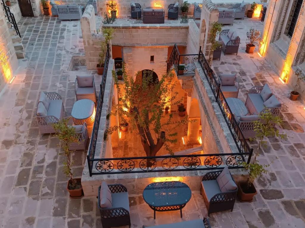 an overhead view of a fountain in a courtyard at Legacy Mesopotamia Hotel in Mardin
