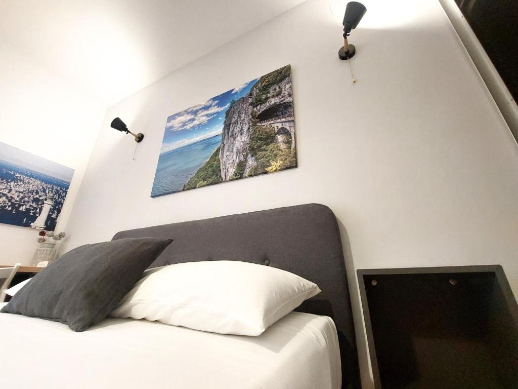 Letto o letti in una camera di MyWay Trieste Rooms