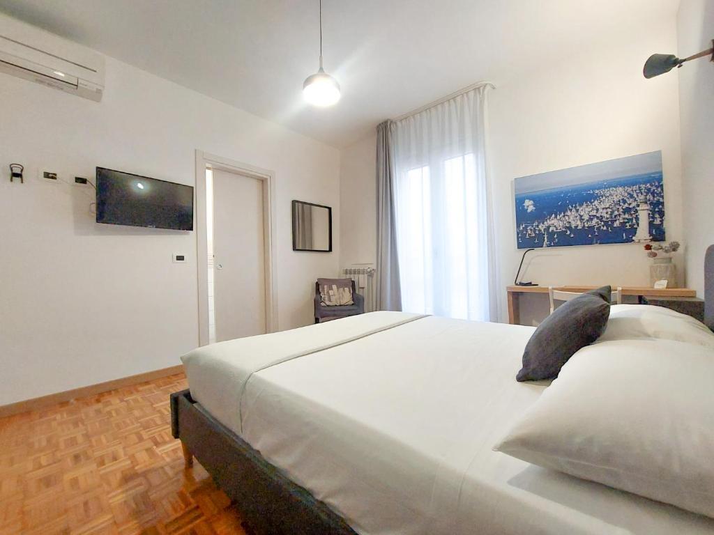 Letto o letti in una camera di MyWay Trieste Rooms