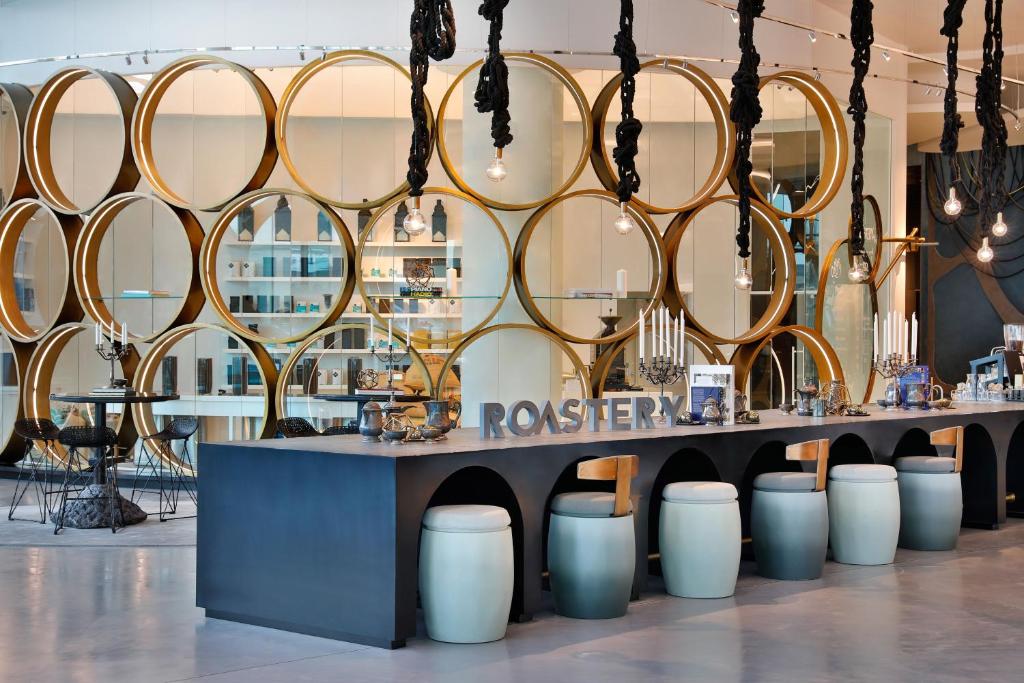 a room with a table with a bunch of mirrors at W Abu Dhabi - Yas Island in Abu Dhabi