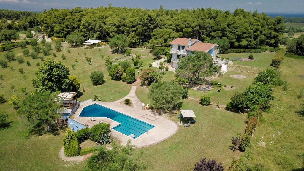 an aerial view of a large estate with a swimming pool at Olivos Villa Sani in Sani Beach