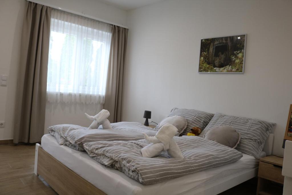 Postel nebo postele na pokoji v ubytování Rezeda Vendégház