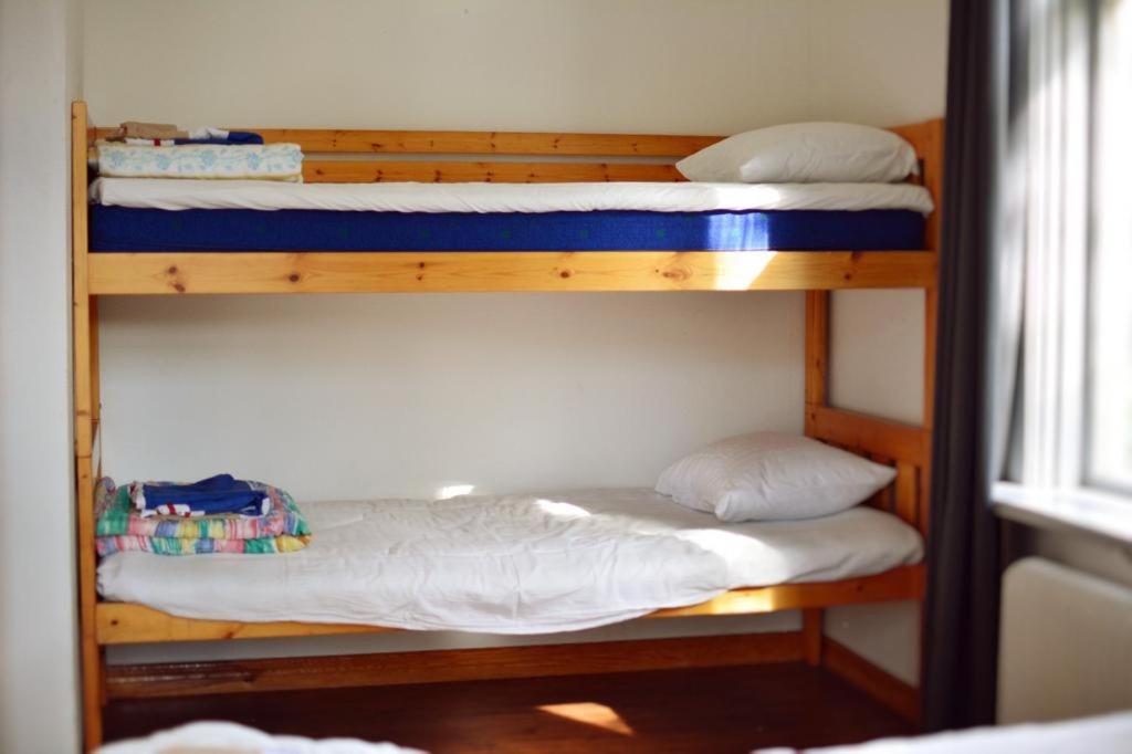 Postel nebo postele na pokoji v ubytování Piece of Hjo Vandrarhem