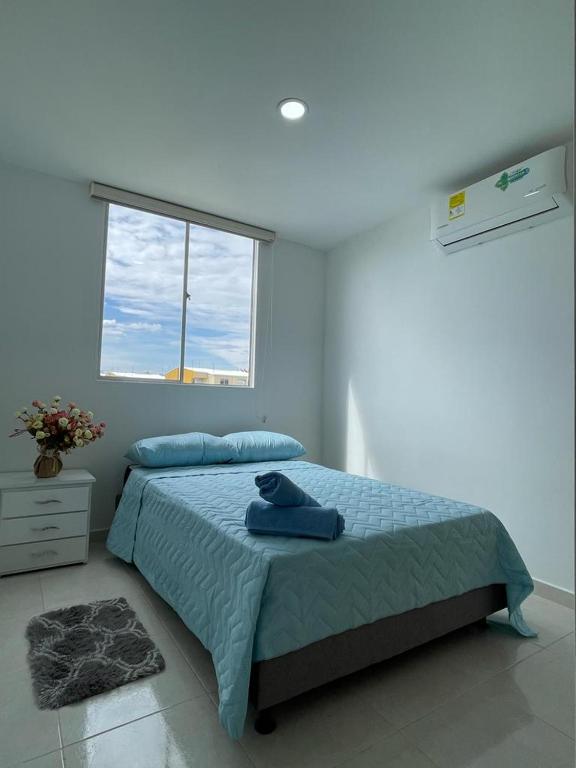 Postel nebo postele na pokoji v ubytování CB Somos AT HOME Apto cómodo e impecable con Aire Acondicionado