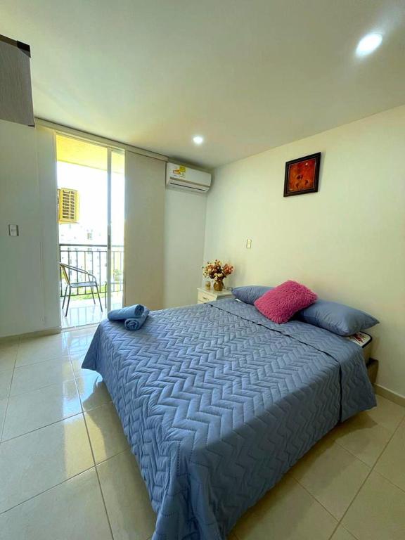 Postel nebo postele na pokoji v ubytování CB Somos AT HOME Apto cómodo e impecable con Aire Acondicionado
