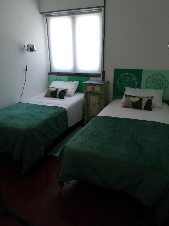 Postel nebo postele na pokoji v ubytování I Love My Home - apartamento