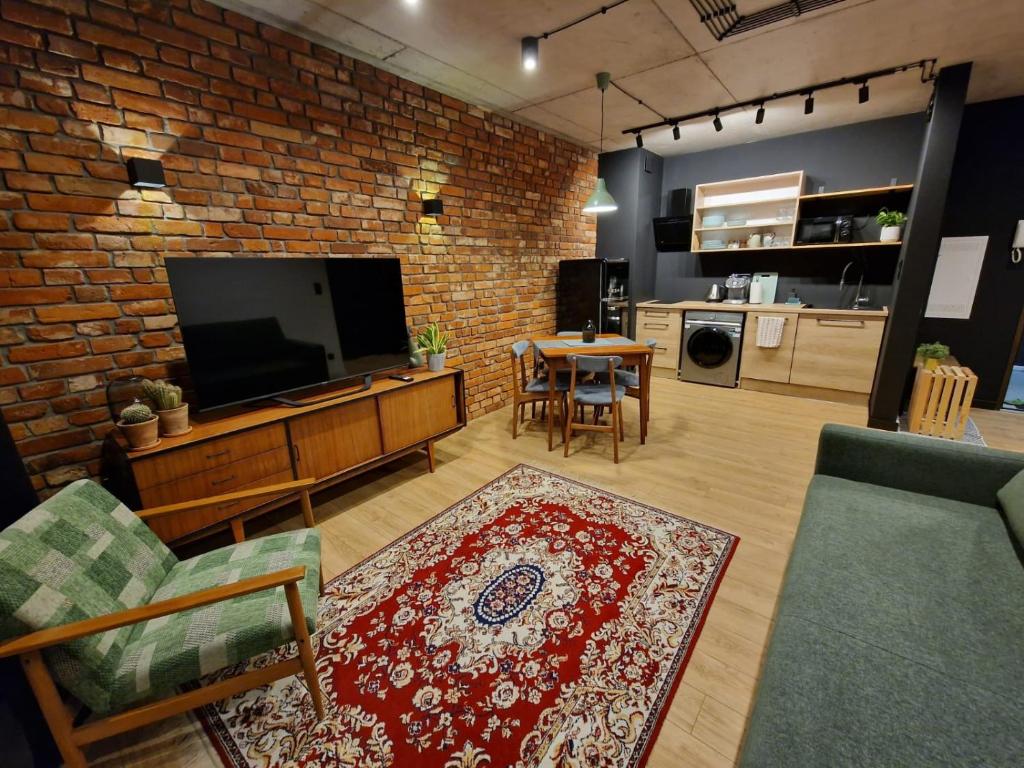 TV in/ali zabaviščno središče v nastanitvi Apartament LOFTykocin