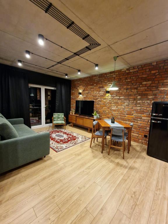 Predel za sedenje v nastanitvi Apartament LOFTykocin
