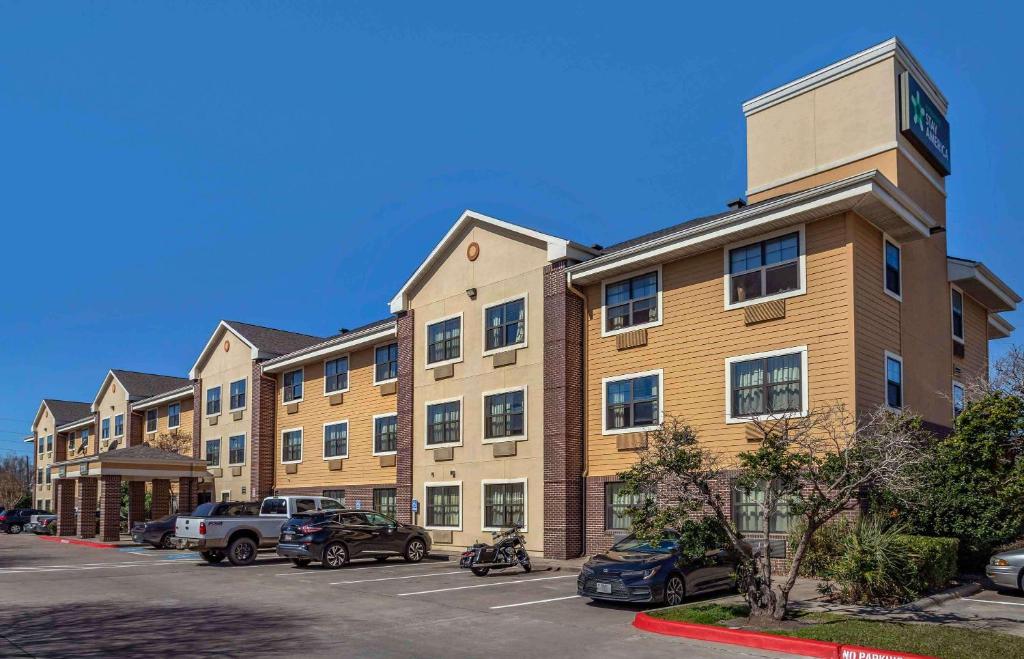 a building with a clock tower on top of it at Extended Stay America Suites - Houston - Westchase - Richmond in Houston