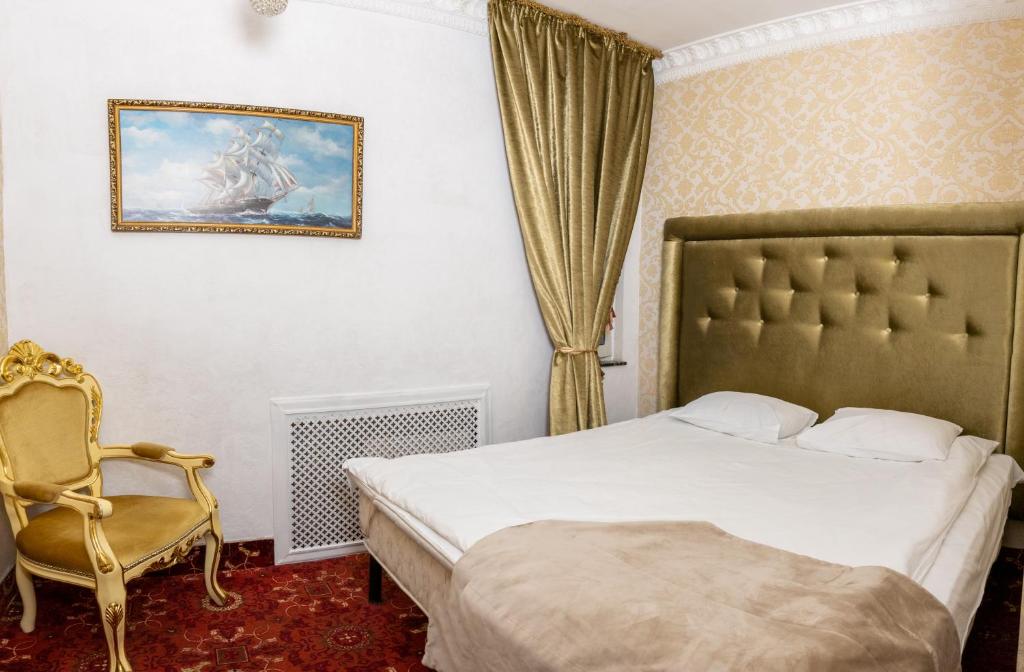 Postel nebo postele na pokoji v ubytování De Paris Hotel