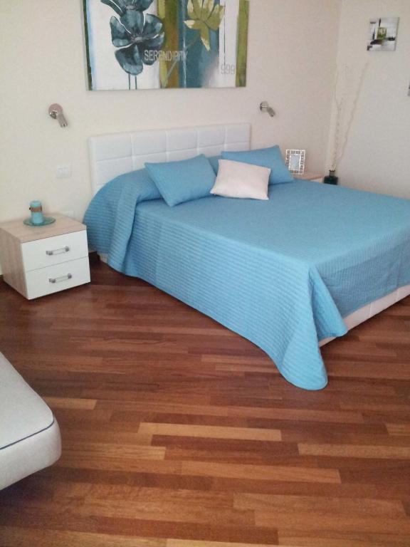 Posteľ alebo postele v izbe v ubytovaní Residenza Piazza Moro