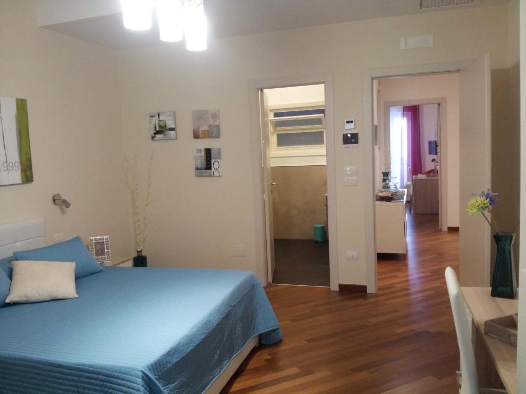 Posteľ alebo postele v izbe v ubytovaní Residenza Piazza Moro