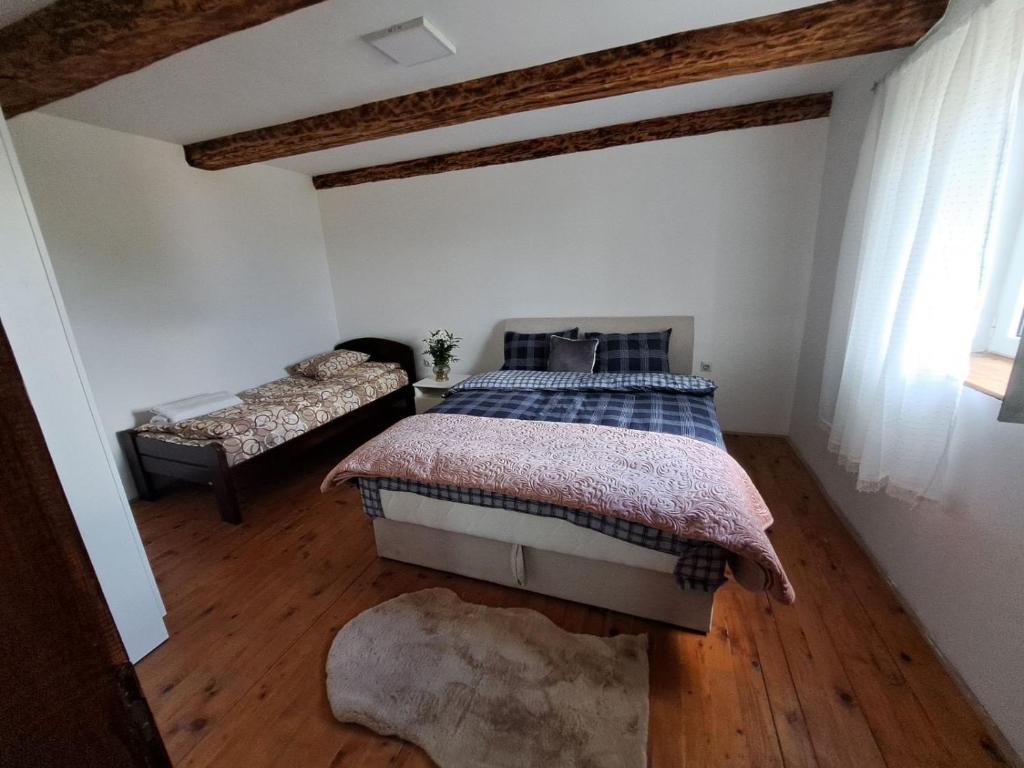 Un pat sau paturi într-o cameră la Guest House Stanic