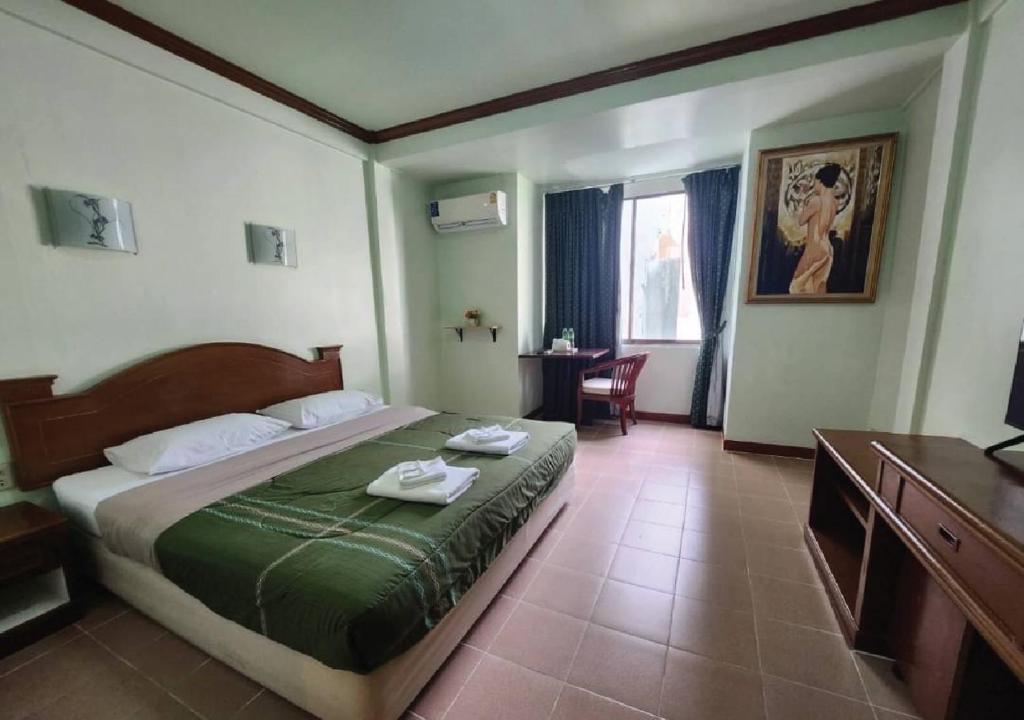 Postel nebo postele na pokoji v ubytování Joys cafe & Guesthouse