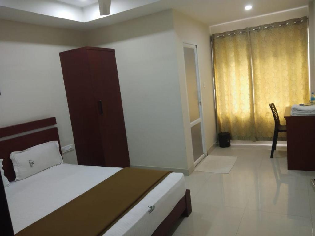 Ένα ή περισσότερα κρεβάτια σε δωμάτιο στο Dream Land Residency