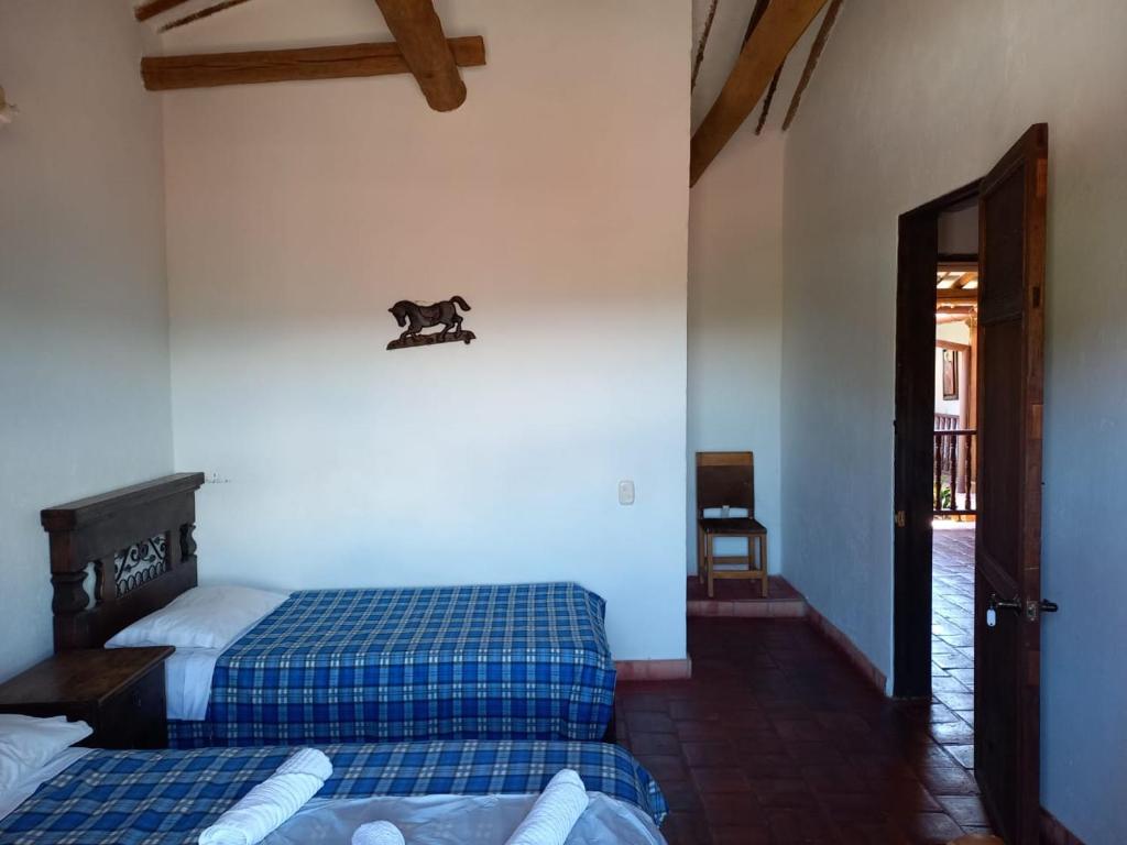 Ένα ή περισσότερα κρεβάτια σε δωμάτιο στο Los recuerdos de Carmen