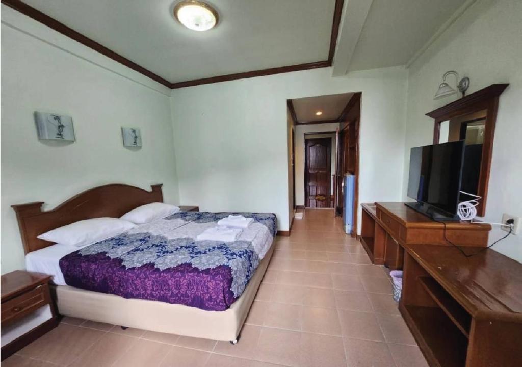 Postel nebo postele na pokoji v ubytování Joys cafe & Guesthouse