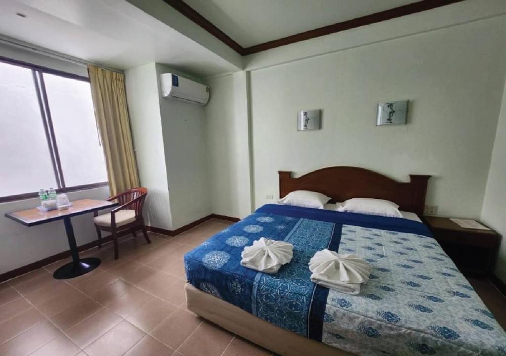 Postel nebo postele na pokoji v ubytování Joys cafe & Guesthouse