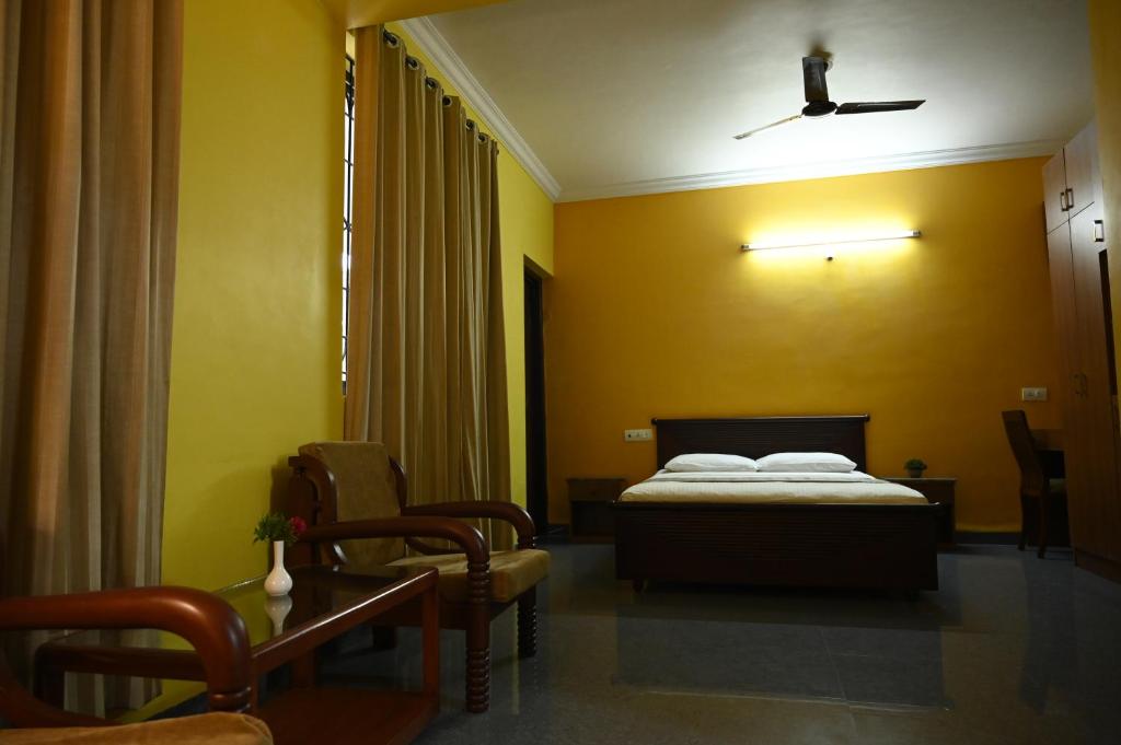 Postel nebo postele na pokoji v ubytování Hotel Siesta De Goa