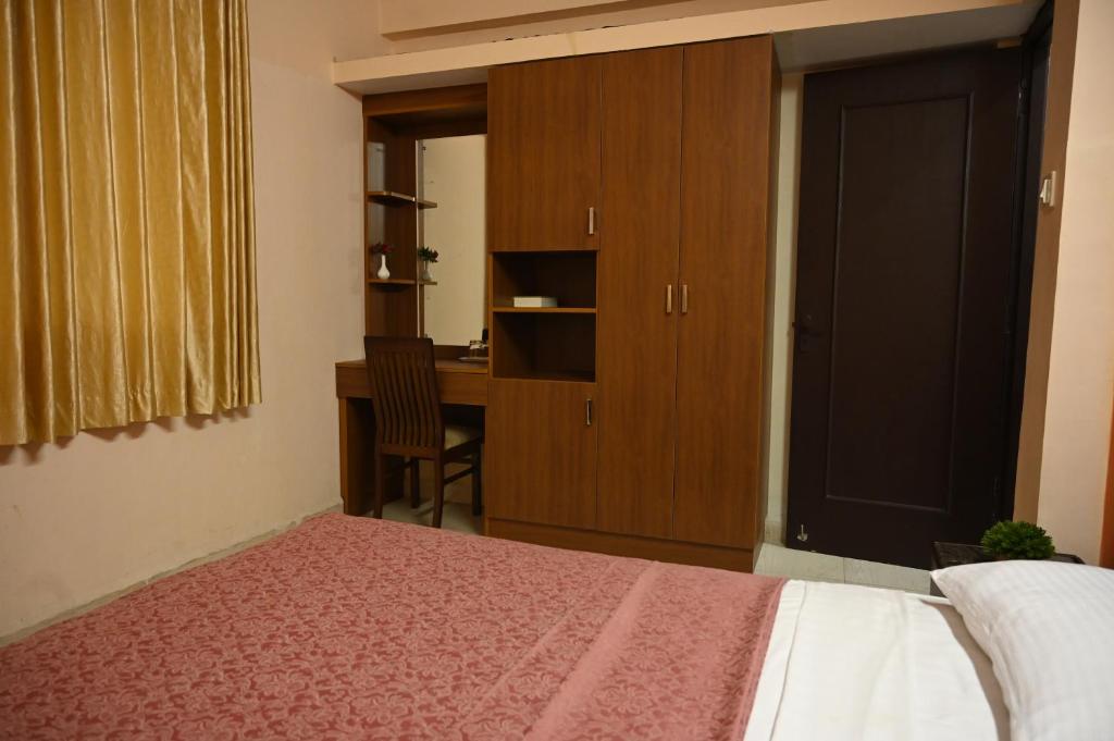Postel nebo postele na pokoji v ubytování Hotel Siesta De Goa