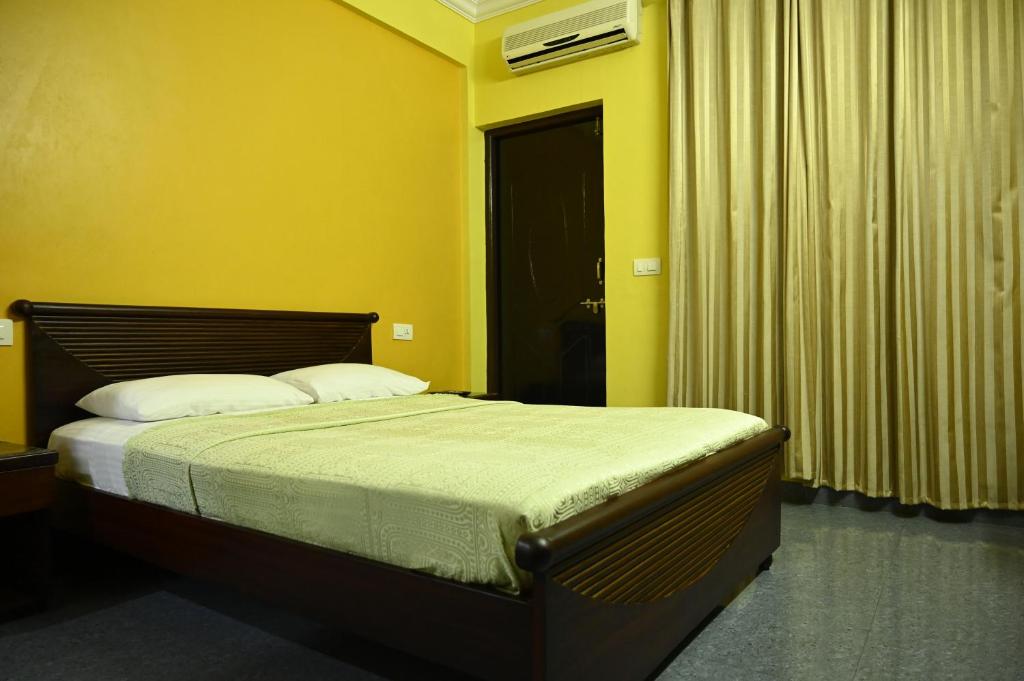 Postel nebo postele na pokoji v ubytování Hotel Siesta De Goa