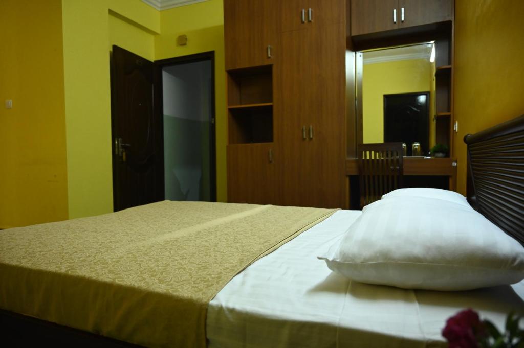 Postel nebo postele na pokoji v ubytování Hotel Siesta De Goa