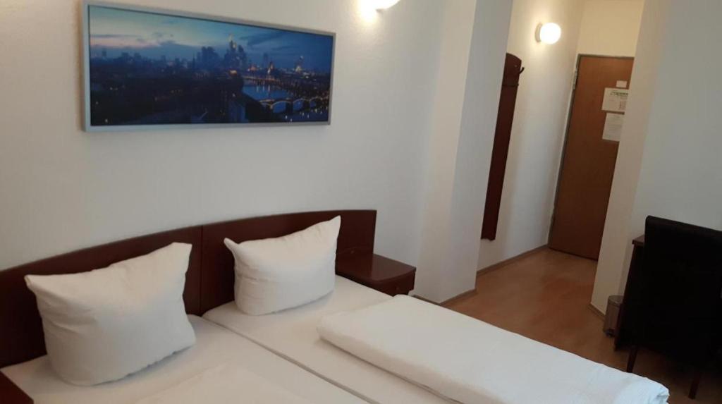 Postel nebo postele na pokoji v ubytování Hotel Aurelia