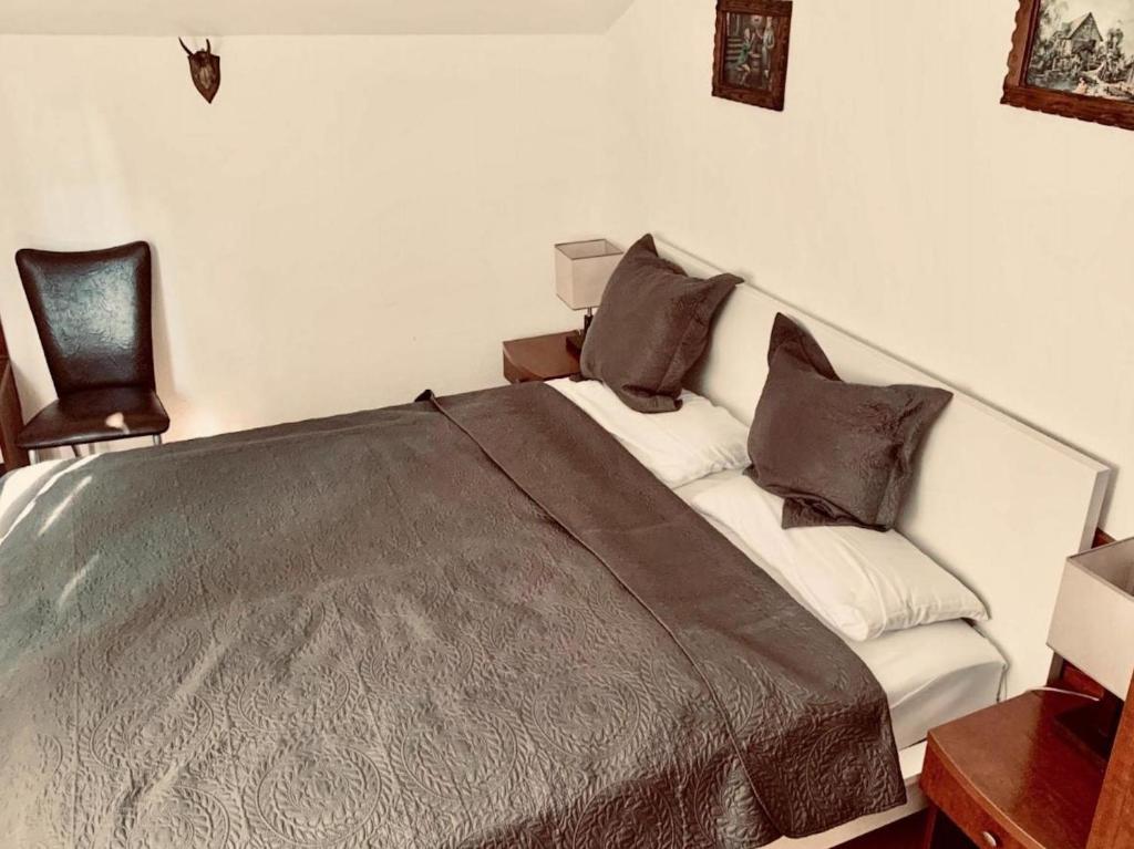Postel nebo postele na pokoji v ubytování Hotel Aurelia