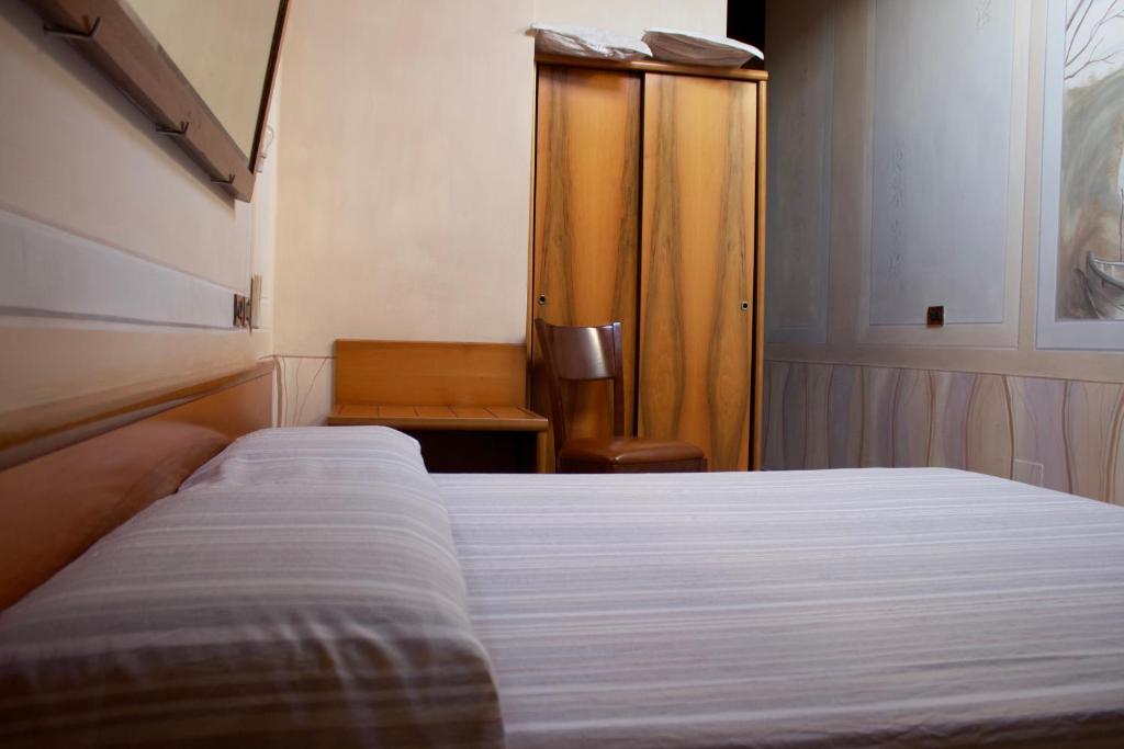 Postel nebo postele na pokoji v ubytování Albergo Giulia Gonzaga
