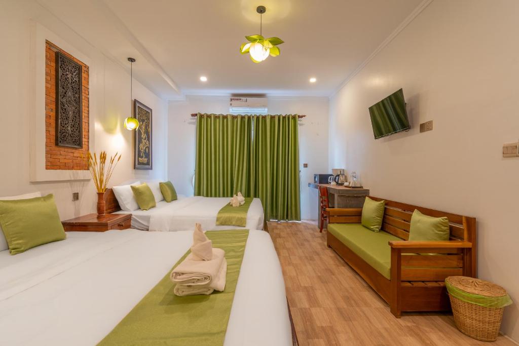 Postel nebo postele na pokoji v ubytování Angkor Rithy Boutiquese