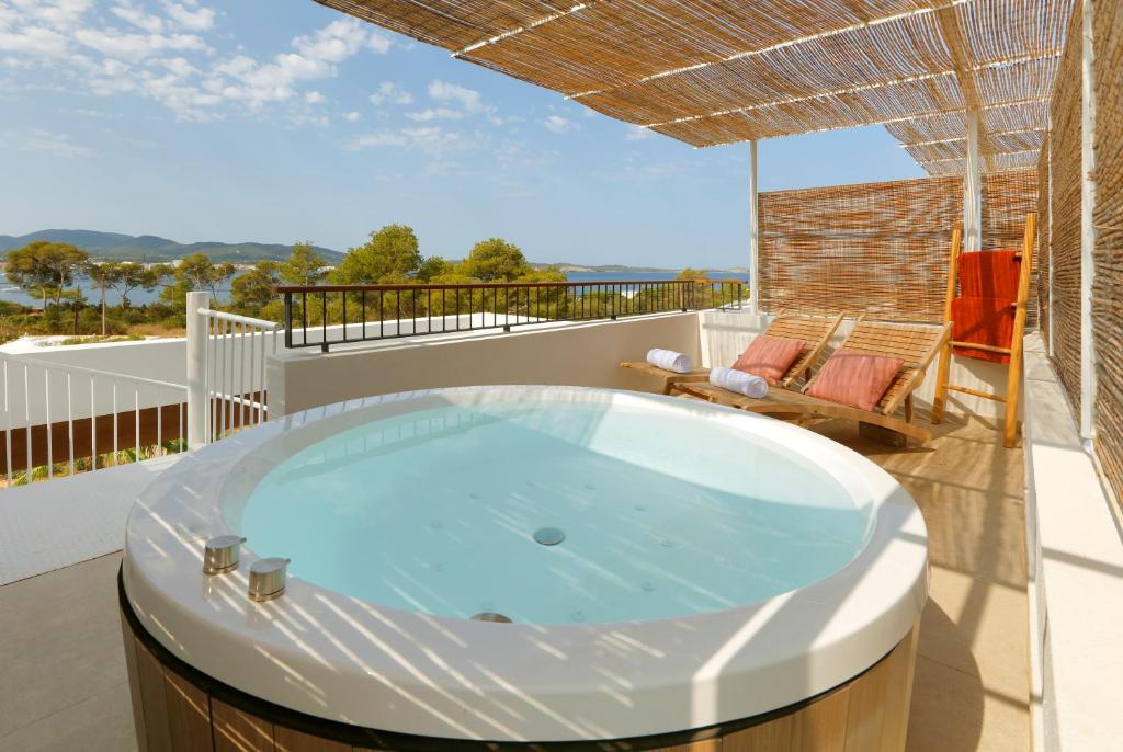 a hot tub on the roof of a house at The Signature Level at TRS Ibiza Hotel - All Inclusive Adults Only - Entrance to Clubs included in San Antonio