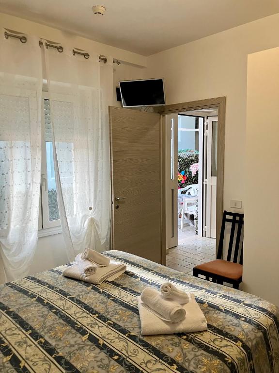 Postel nebo postele na pokoji v ubytování Hotel Ginevra e Residence