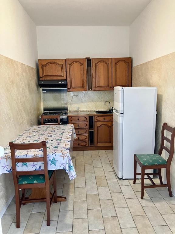 Kuchyň nebo kuchyňský kout v ubytování Hotel Ginevra e Residence