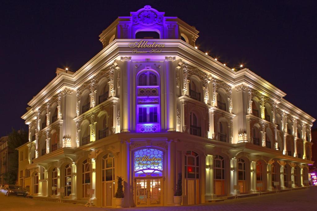 a lit up building with a purple sign on it at Albatros Premier Hotel in Istanbul