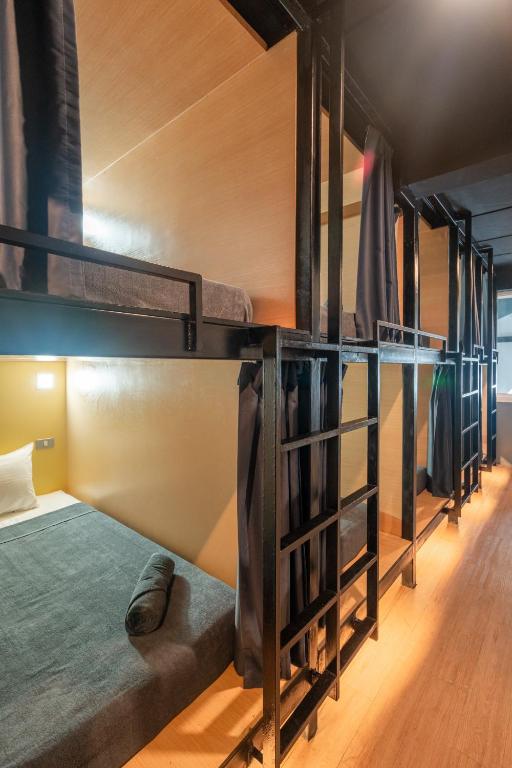 Postel nebo postele na pokoji v ubytování Black Panther Hostel