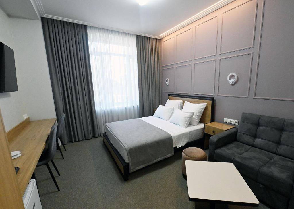 Postel nebo postele na pokoji v ubytování Prime Hotel