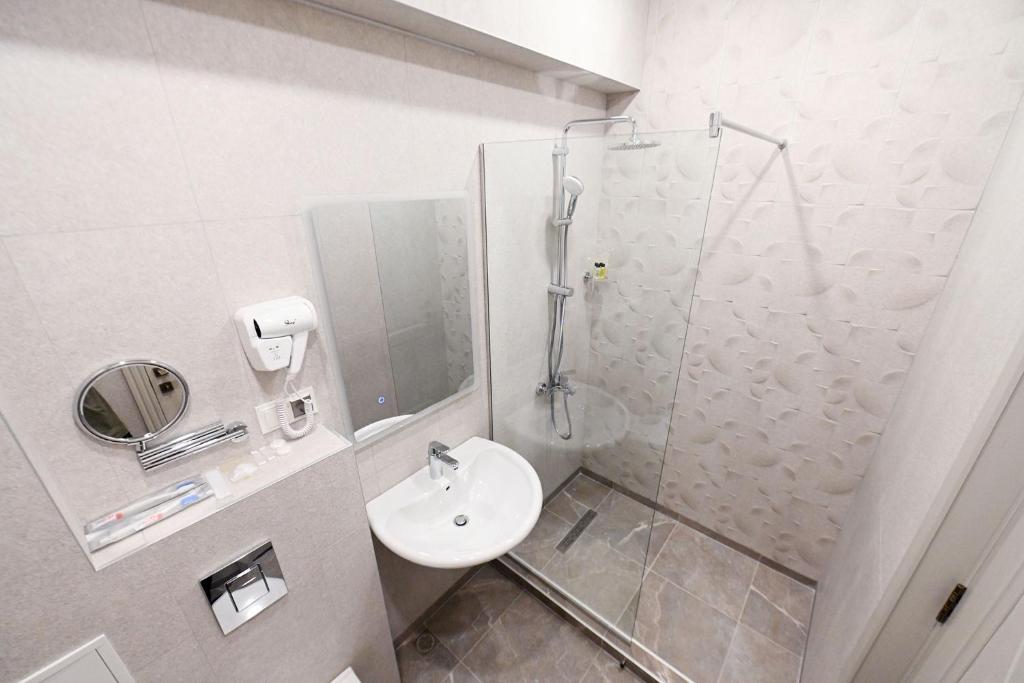 Koupelna v ubytování Prime Hotel