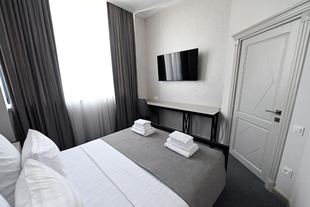 Postel nebo postele na pokoji v ubytování Prime Hotel