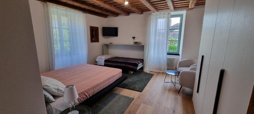 Postel nebo postele na pokoji v ubytování Casa Vacanza Ex Pretura Vallelaghi