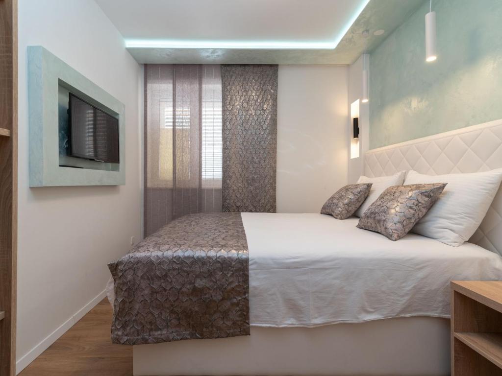 Postel nebo postele na pokoji v ubytování Apartment Mornar-3 by Interhome