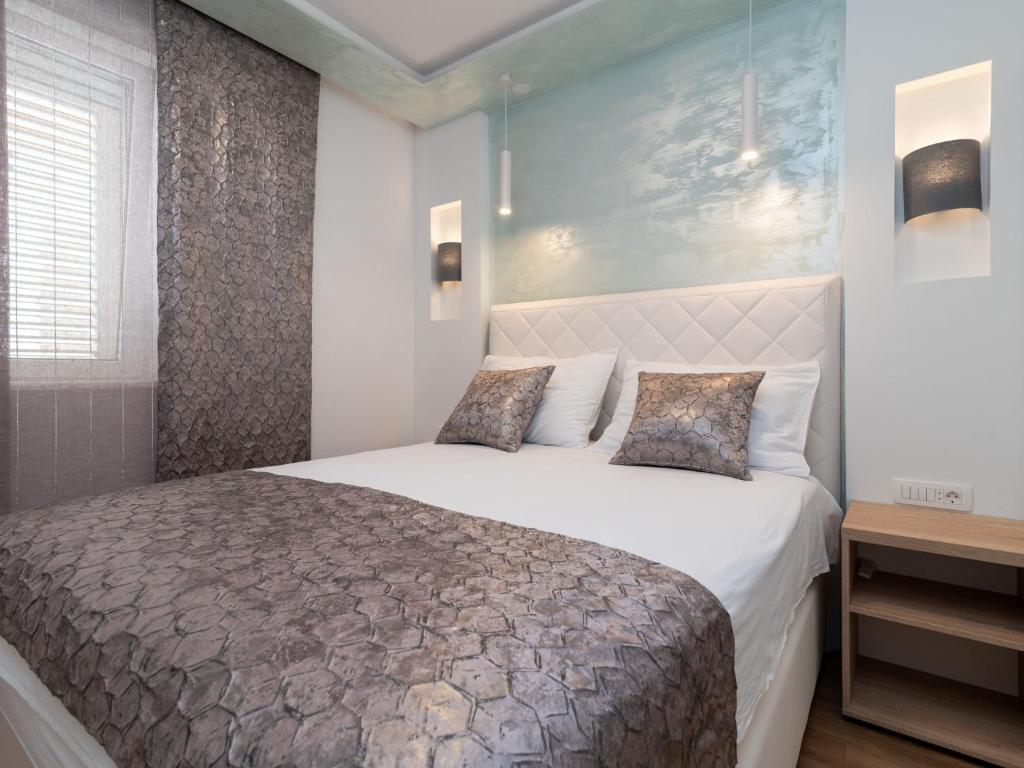 Postel nebo postele na pokoji v ubytování Apartment Mornar-3 by Interhome