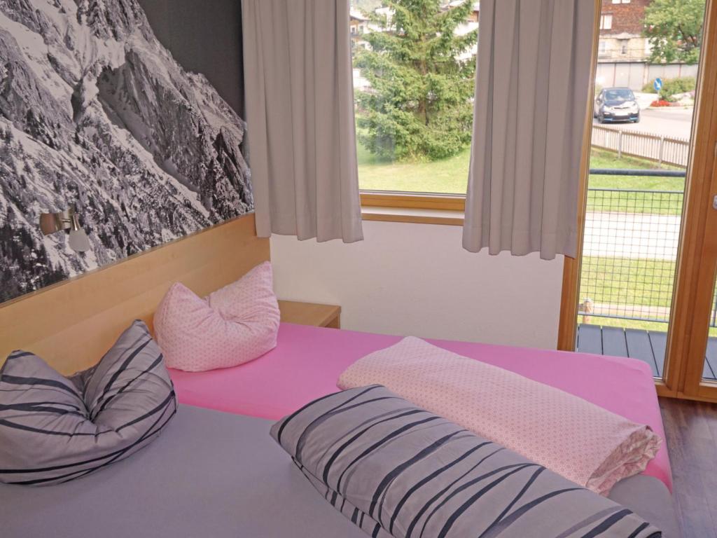 Posteľ alebo postele v izbe v ubytovaní Apartment Flirscherblick by Interhome