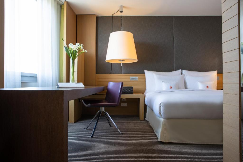 Ένα ή περισσότερα κρεβάτια σε δωμάτιο στο InterContinental Genève by IHG