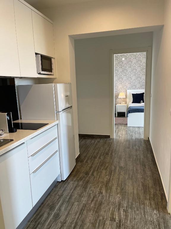 Kuchyň nebo kuchyňský kout v ubytování Apartments Domani