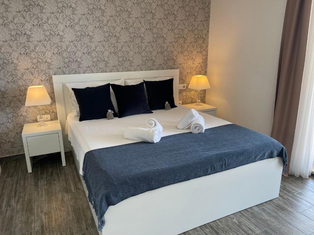 Postel nebo postele na pokoji v ubytování Apartments Domani