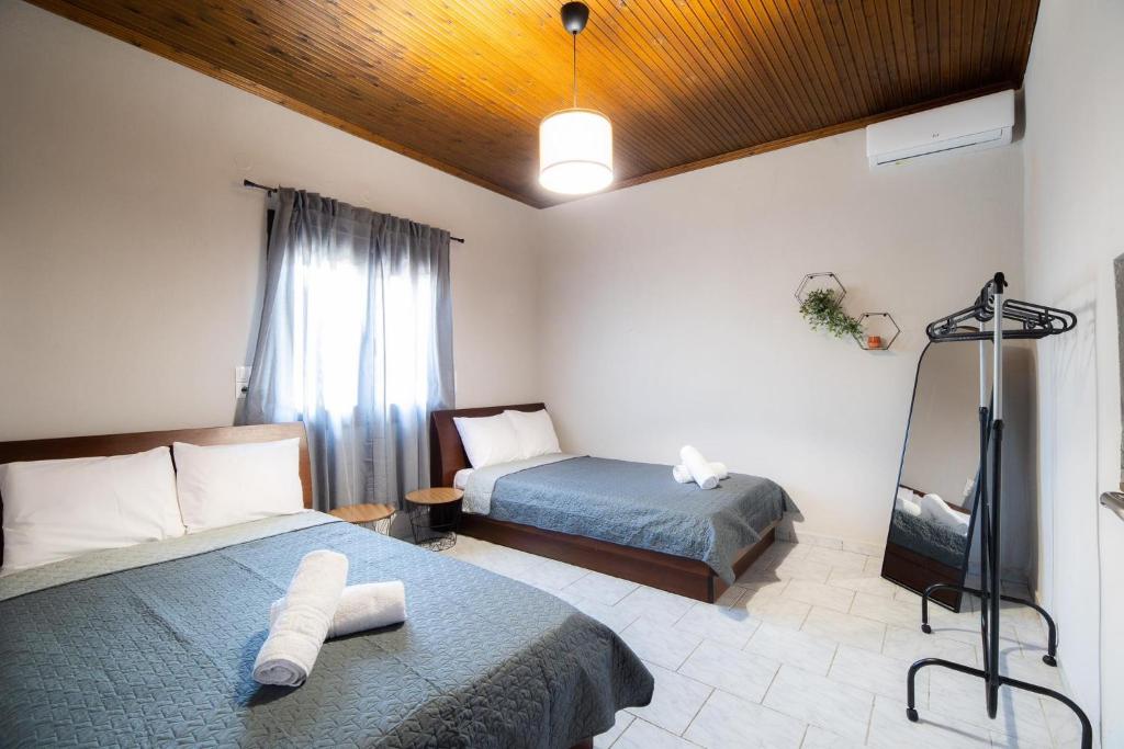 Postel nebo postele na pokoji v ubytování Casa con pozo Platamonas