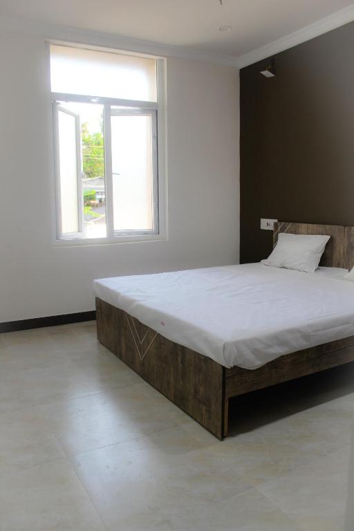 Postel nebo postele na pokoji v ubytování SAN BEACH RESIDENCY