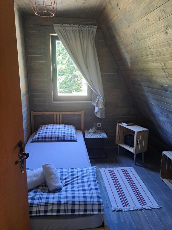 Postel nebo postele na pokoji v ubytování ZlatAir Eco Chalet
